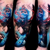 Abstract style colored arm tattoo of mystical fantasy demon face