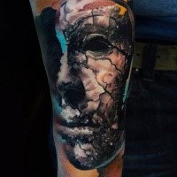 Abstract style colored arm tattoo of corrupted mask