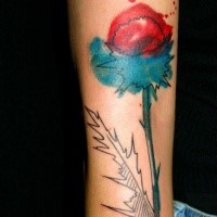 Abstract style colored arm tattoo of big flower