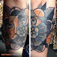 Abstract style colored arm tattoo of big geometrical flower and woman eyes