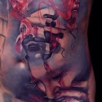 Abstract style colored belly tattoo of mystical faces and skull