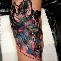 Abstract style colored biceps tattoo of sad wolf