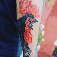 Abstract style colored cock tattoo on sleeve