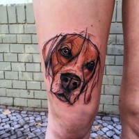 Abstract style colored dog portrait tattoo on thigh