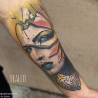 Abstract style colored forearm tattoo of woman portrait with various ornaments