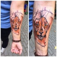 Abstract style colored forearm tattoo of lion face