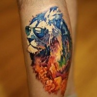 Abstract style colored leg tattoo of lion with sunglasses