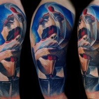 Abstract style colored shoulder tattoo of amazing designed human face