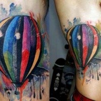 Abstract style colored side tattoo of flying balloon