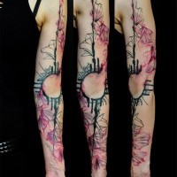 Abstract style colored sleeve tattoo of various wild flowers