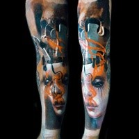 Abstract style colored sleeve tattoo of woman with puzzle