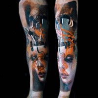 Abstract style colored sleeve tattoo of woman mask with puzzle piece