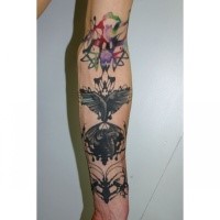 Abstract style colored sleeve tattoo of butterfly with ornaments