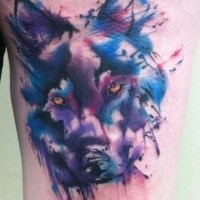 Abstract style colored thigh tattoo of mystical wolf head