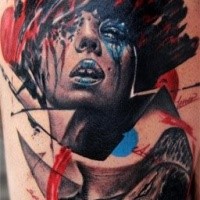 Abstract style colored thigh tattoo of woman face with ornaments