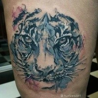 Abstract style colored thigh tattoo of tiger portrait