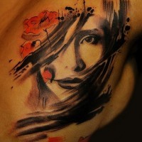 Abstract style half colored chest tattoo of woman portrait and wildflowers