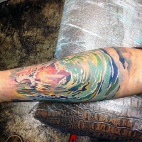 Abstract style multicolored ocean waves tattoo on arm
