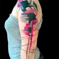 Abstract style multicolored watercolor tattoo on arm