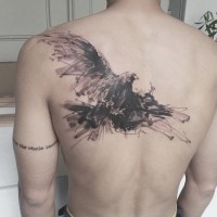 Abstract style painted big black and white eagle tattoo on back