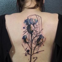 Abstract style watercolor like back tattoo of flowers