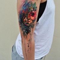 Abstract style watercolor shoulder tattoo of woman portrait with berries