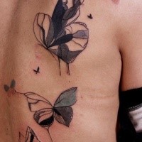 Abstract watercolor style big butterfly tattoo on back