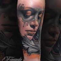 Accurate colored and detailed mystical sad woman portrait tattoo on forearm with feather
