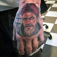 Accurate painted and colored old sailor portrait tattoo on hand