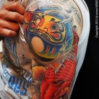 Accurate painted and colored shoulder tattoo of Asian daruma doll with carp fish