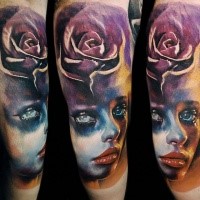Accurate painted and colored tattoo of woman face stylized with rose