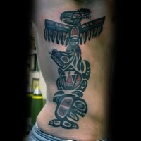 Accurate painted and colored tribal statue tattoo on side