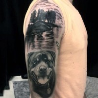 Accurate painted black and white dog on forest lake shore half sleeve area tattoo