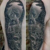 Accurate painted black ink angel tattoo on shoulder combined with mystic portrait