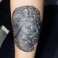 Accurate painted black ink very detailed Vaders mask tattoo on forearm stylized with tribal ornaments