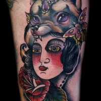 Accurate painted old school colored gypsy witch tattoo on arm stylized with flowers and butterfly