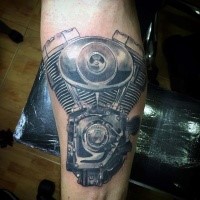 Accurate painted very detailed engine tattoo on arm