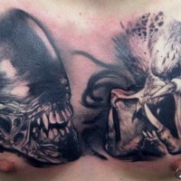 Alien and predator tattoo on chest