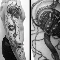 Alien like big black and white detailed jellyfish tattoo on sleeve