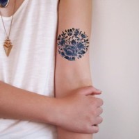 Amazing dark blue flowers tattoo on arm for girls