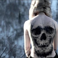 Amazing spooky skull tattoo on back