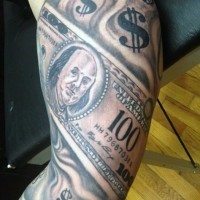 Amazing black and white dollar bills tattoo on biceps