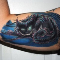 Amazing colored big fantasy cat tattoo on biceps