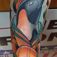 Amazing colored ink penguin tattoo for man