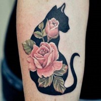Amazing colored little flowers with shadow cat tattoo on leg