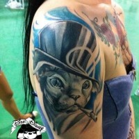Amazing funny looking colored smoking gentleman style Sphinx cat tattoo on shoulder