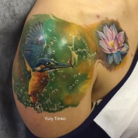 Amazing hummingbird with flower tattoo by Timko