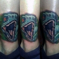 Amazing illustrative style colored leg tattoo of angry dinosaur