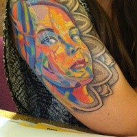 Amazing looking colored shoulder tattoo of woman portrait