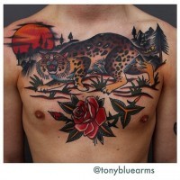 Amazing old school colored leopard in wild life tattoo on chest with flower